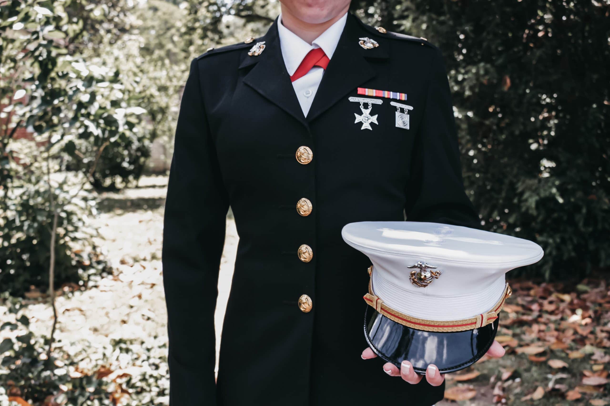 female veteran holding dress cap